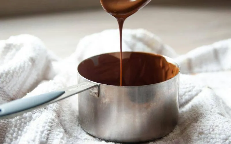 Warm melted chocolate poured into a small pot